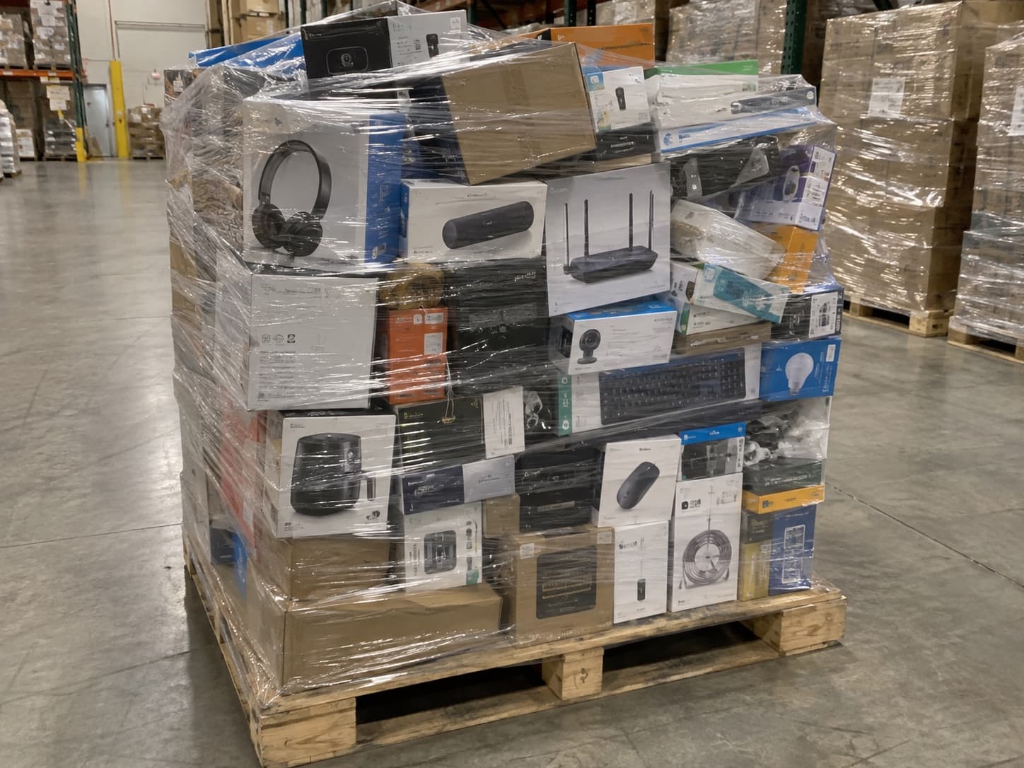 Palletized mixed electronics returns wrapped and ready for resale