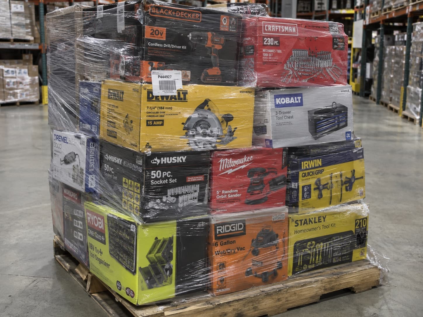 Pallet of mixed power tools including drills, saws and mechanics tool sets