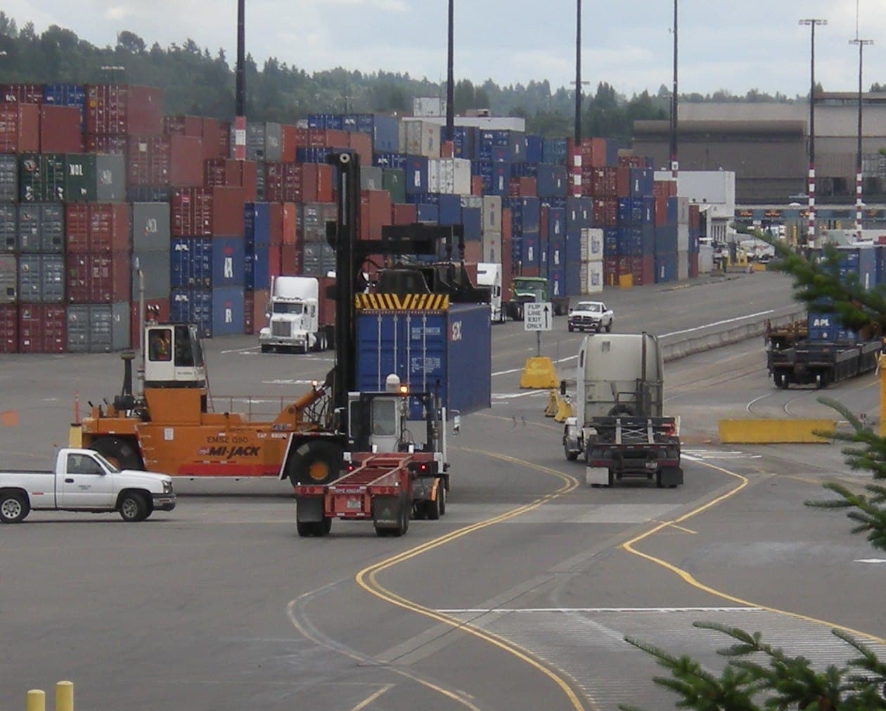 Shipping container transfer at a freight terminal